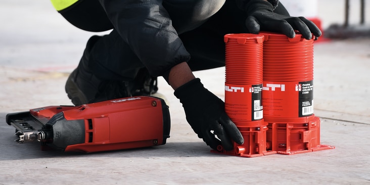 Hilti firestop cast-in sleeves for cables and pipes being placed on concrete slabs after laying them out in BIM