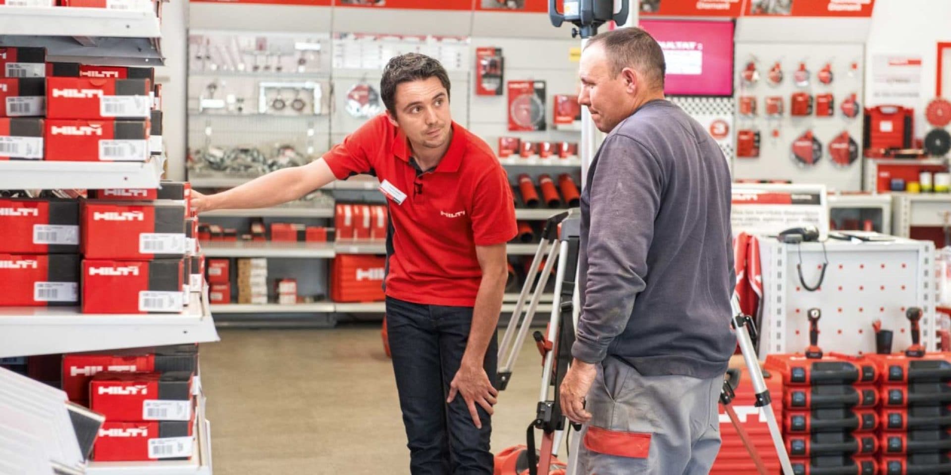 Hilti representative helping a customer find what they need at a Hilti store