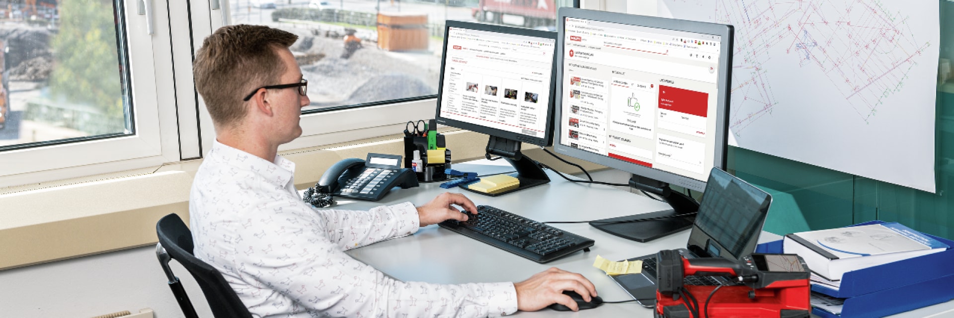 Man at computer, learning on Hilti Academy